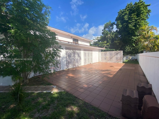 290 NE 108th St, Miami, FL 33161 - fenced backyard featuring a patio