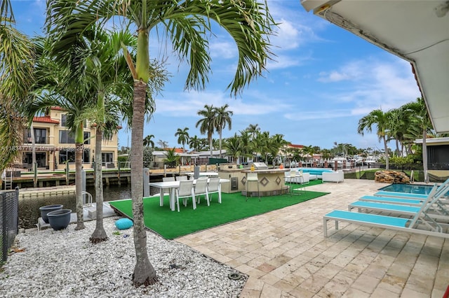 2321 SE 15th St, Pompano Beach, FL 33062 - view of patio featuring a community pool and a water view