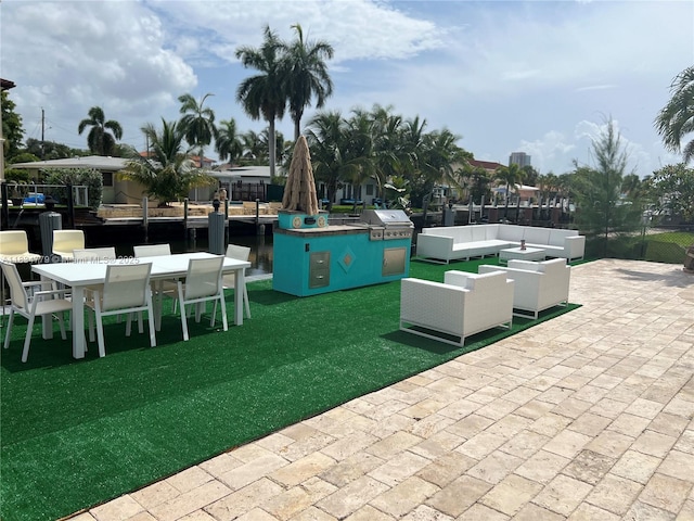 2321 SE 15th St, Pompano Beach, FL 33062 - view of home's community featuring a patio, outdoor dining area, and an outdoor living space
