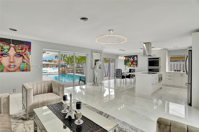 2321 SE 15th St, Pompano Beach, FL 33062 - living area with light marble finish flooring and baseboards