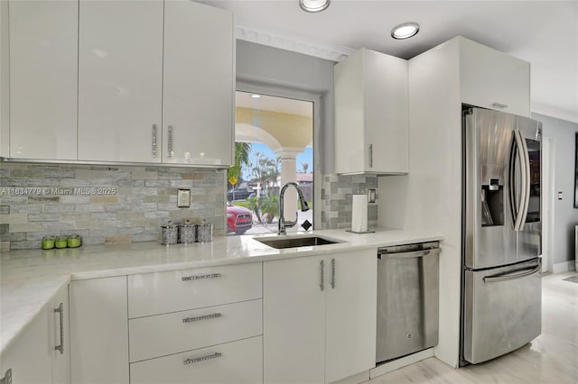 2321 SE 15th St, Pompano Beach, FL 33062 - kitchen featuring stainless steel appliances, decorative backsplash, white cabinets, and recessed lighting