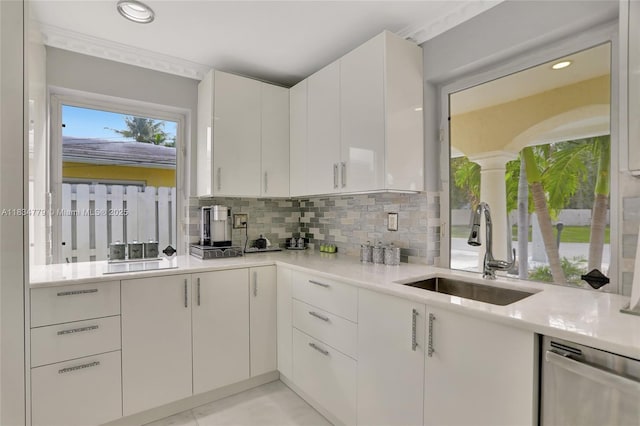 2321 SE 15th St, Pompano Beach, FL 33062 - kitchen with stainless steel dishwasher, decorative backsplash, light countertops, white cabinets, and recessed lighting