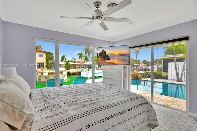2321 SE 15th St, Pompano Beach, FL 33062 - carpeted bedroom featuring access to exterior, multiple windows, and ceiling fan