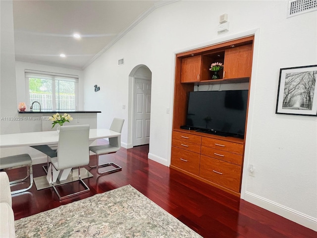 2817 SW 187th Ave, Miramar, FL 33029 - dining room with vaulted ceiling, ornamental molding, arched walkways, and dark wood-type flooring