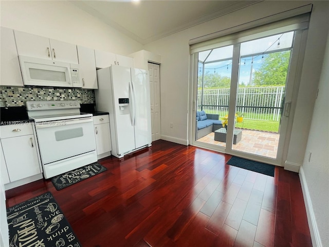 2817 SW 187th Ave, Miramar, FL 33029 - kitchen with white appliances, dark countertops, ornamental molding, dark wood finished floors, and decorative backsplash