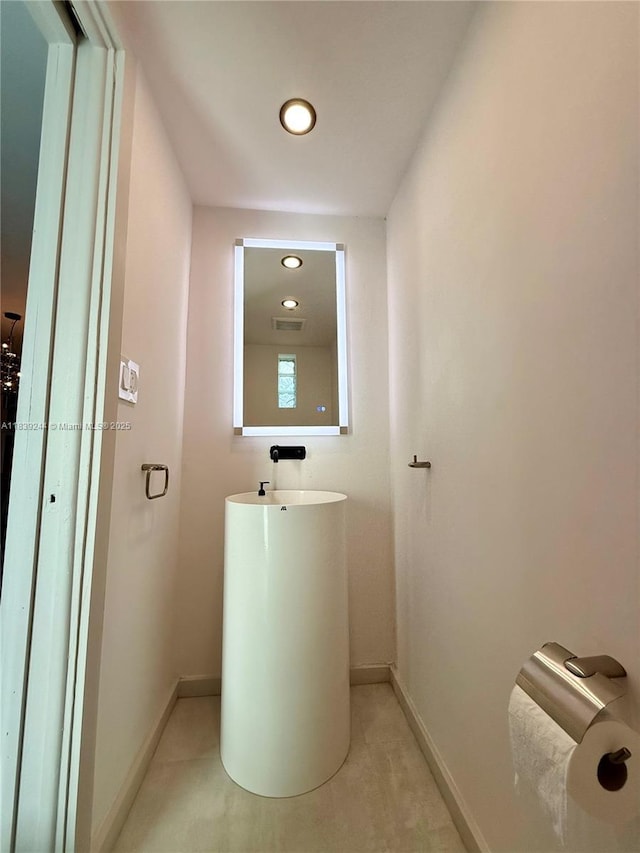 1945 NE 123rd St, North Miami, FL 33181 - bathroom featuring baseboards and recessed lighting