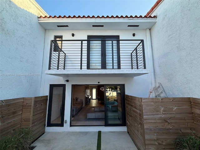 1945 NE 123rd St, North Miami, FL 33181 - doorway to property featuring a balcony and stucco siding