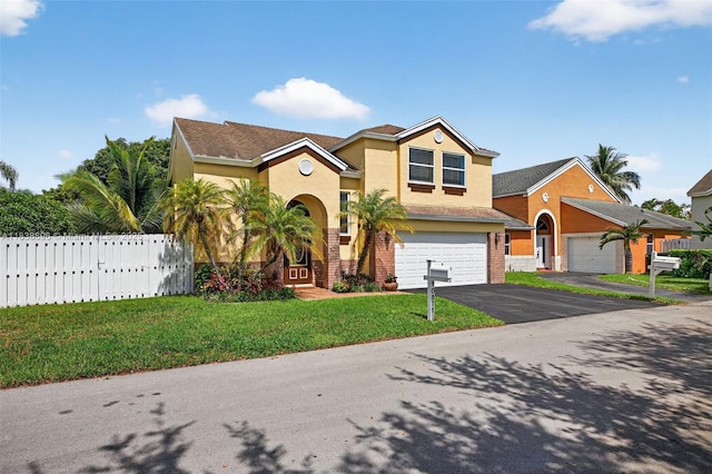 10871 SW 11th Mnr, Davie, FL 33324 - view of front of home with driveway, a garage, and stucco siding