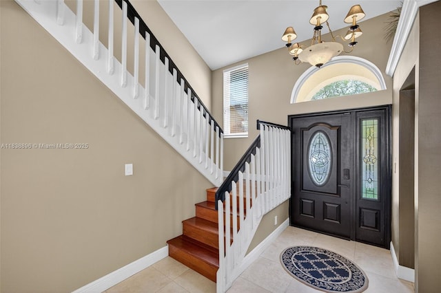 10871 SW 11th Mnr, Davie, FL 33324 - foyer entrance featuring stairs, tile patterned floors, a chandelier, and a towering ceiling