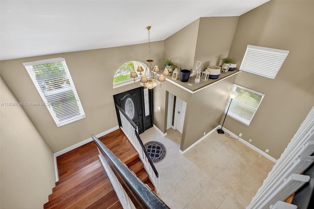 10871 SW 11th Mnr, Davie, FL 33324 - staircase featuring a chandelier and lofted ceiling