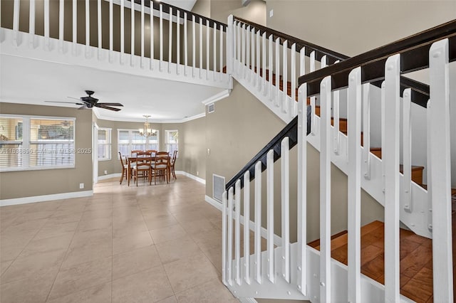 10871 SW 11th Mnr, Davie, FL 33324 - stairs featuring ornamental molding, a chandelier, tile patterned floors, and a ceiling fan