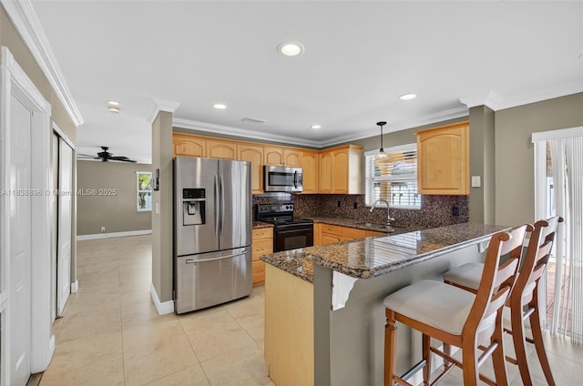 10871 SW 11th Mnr, Davie, FL 33324 - kitchen with appliances with stainless steel finishes, a peninsula, tasteful backsplash, crown molding, and a kitchen breakfast bar