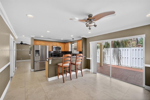 10871 SW 11th Mnr, Davie, FL 33324 - kitchen with stainless steel appliances, ceiling fan, ornamental molding, tasteful backsplash, and a breakfast bar