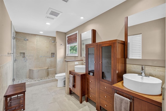 10871 SW 11th Mnr, Davie, FL 33324 - bathroom featuring a shower stall, tile walls, vanity, tile patterned floors, and recessed lighting