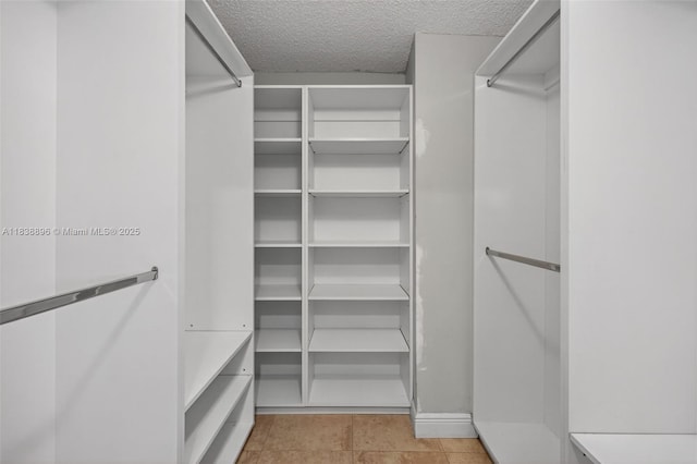 10871 SW 11th Mnr, Davie, FL 33324 - walk in closet featuring tile patterned floors