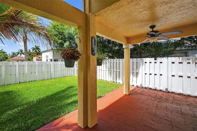 10871 SW 11th Mnr, Davie, FL 33324 - fenced backyard featuring a patio and ceiling fan