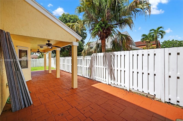 10871 SW 11th Mnr, Davie, FL 33324 - fenced backyard featuring ceiling fan and a patio