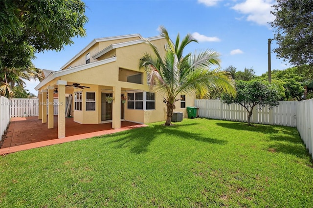 10871 SW 11th Mnr, Davie, FL 33324 - rear view of house featuring a ceiling fan, stucco siding, a fenced backyard, and a patio