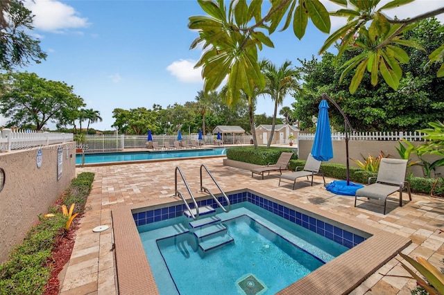 10871 SW 11th Mnr, Davie, FL 33324 - community pool featuring a community hot tub and a patio area
