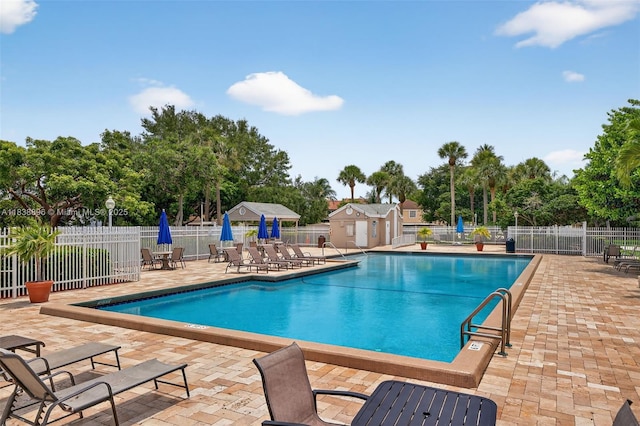 10871 SW 11th Mnr, Davie, FL 33324 - community pool featuring a patio area and view of scattered trees