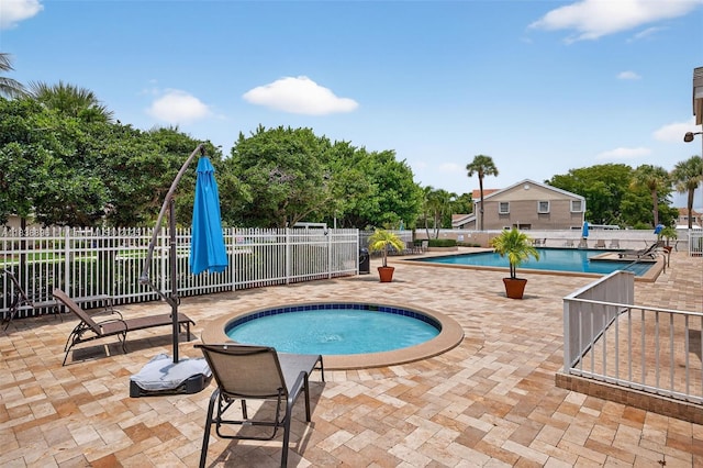 10871 SW 11th Mnr, Davie, FL 33324 - community pool featuring a hot tub and a patio