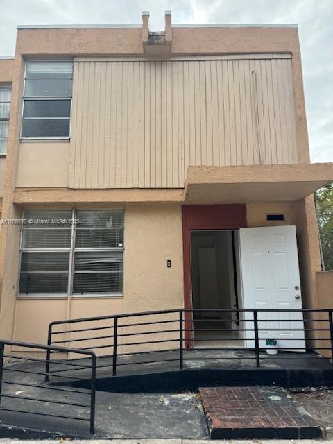6023 SW 69th St Unit 78, South Miami, FL 33143 - view of front of property featuring stucco siding