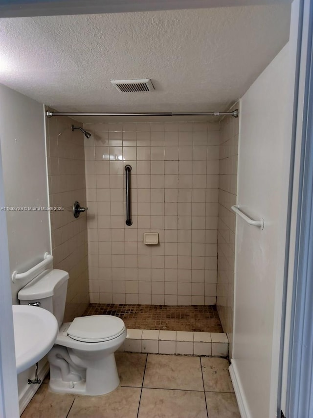 6023 SW 69th St Unit 78, South Miami, FL 33143 - full bath featuring a stall shower, a textured ceiling, and tile patterned floors