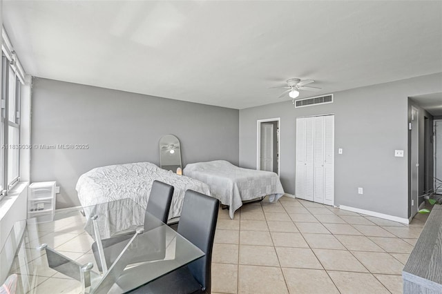 2899 Collins Ave Unit 931, Miami Beach, FL 33140 - bedroom featuring a ceiling fan and light tile patterned flooring