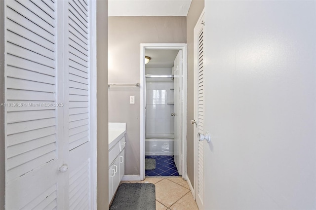 2899 Collins Ave Unit 931, Miami Beach, FL 33140 - bathroom featuring a closet, vanity, tile patterned flooring, and bathtub / shower combination