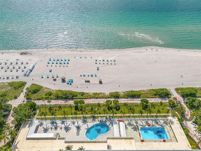 2899 Collins Ave Unit 931, Miami Beach, FL 33140 - drone / aerial view of a pool and a large body of water