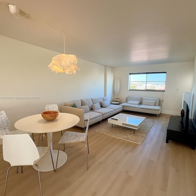 1575 Euclid Ave Unit 505, Miami Beach, FL 33139 - living area with wood finished floors and baseboards