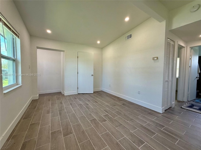 3460 Normandy Dr, Port Charlotte, FL 33952 - unfurnished bedroom with dark wood-style flooring and recessed lighting