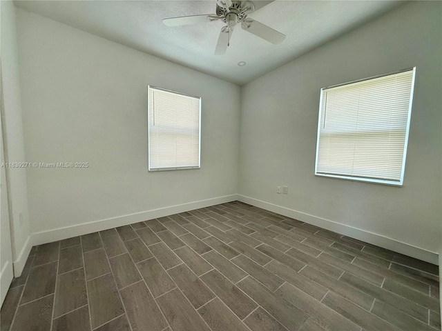 3460 Normandy Dr, Port Charlotte, FL 33952 - unfurnished room featuring plenty of natural light, ceiling fan, and dark wood finished floors
