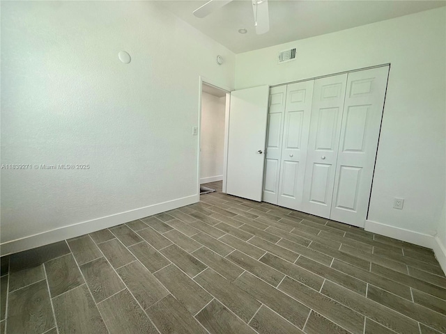 3460 Normandy Dr, Port Charlotte, FL 33952 - unfurnished bedroom featuring wood tiled floors, a closet, and ceiling fan