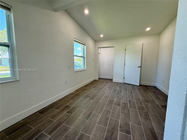 3460 Normandy Dr, Port Charlotte, FL 33952 - unfurnished bedroom with dark wood-type flooring, recessed lighting, and lofted ceiling