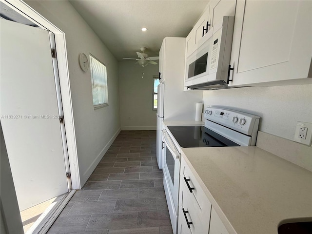 3460 Normandy Dr, Port Charlotte, FL 33952 - kitchen featuring white appliances, white cabinets, a ceiling fan, recessed lighting, and light countertops