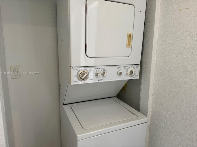 3460 Normandy Dr, Port Charlotte, FL 33952 - laundry room with stacked washer / drying machine and a textured wall