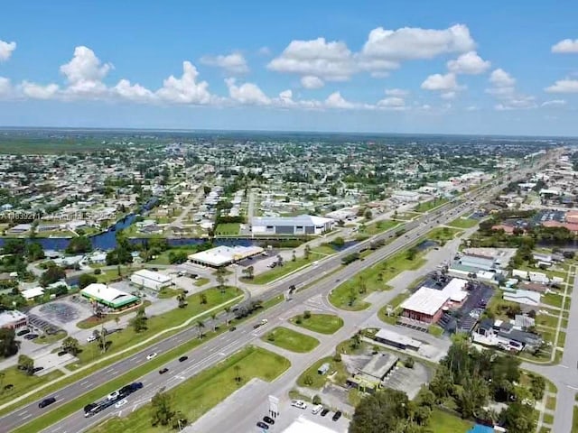 3460 Normandy Dr, Port Charlotte, FL 33952 - aerial view of property and surrounding area with nearby suburban area