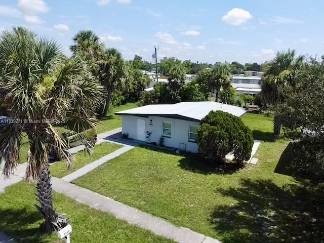3460 Normandy Dr, Port Charlotte, FL 33952 - view of front facade featuring a front lawn and stucco siding