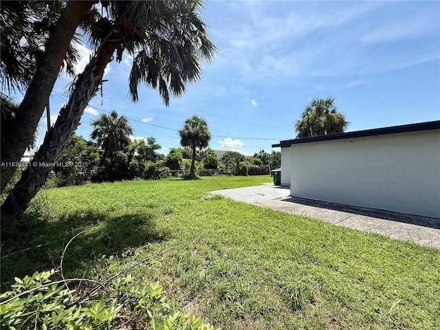 3460 Normandy Dr, Port Charlotte, FL 33952 - view of green lawn featuring a patio