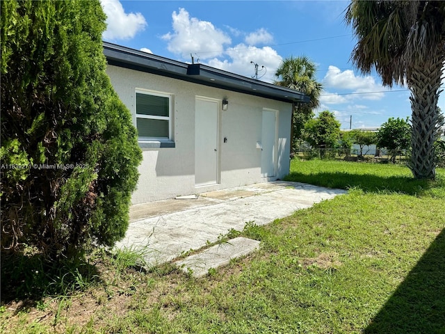 3460 Normandy Dr, Port Charlotte, FL 33952 - rear view of property featuring stucco siding and a patio area