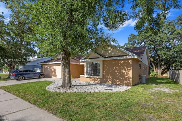 5506 Redhawk Dr, New Port Richey, FL 34655 - view of front of home featuring stucco siding, an attached garage, and concrete driveway