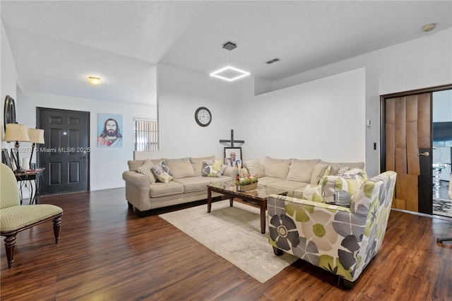 5506 Redhawk Dr, New Port Richey, FL 34655 - living area featuring dark wood-style flooring