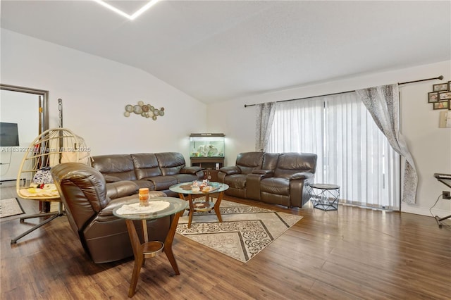 5506 Redhawk Dr, New Port Richey, FL 34655 - living area with vaulted ceiling and wood finished floors