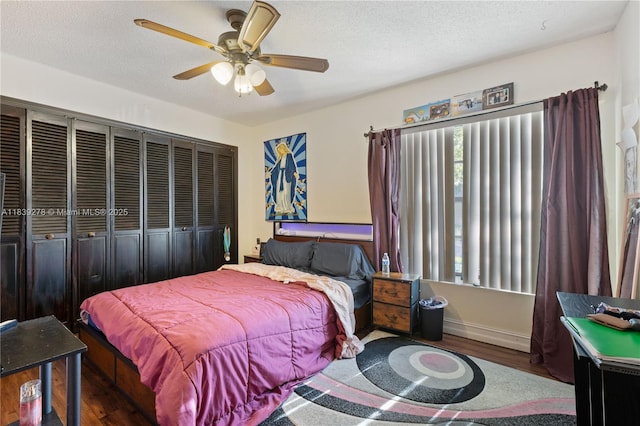 5506 Redhawk Dr, New Port Richey, FL 34655 - bedroom with wood finished floors, ceiling fan, a closet, and a textured ceiling