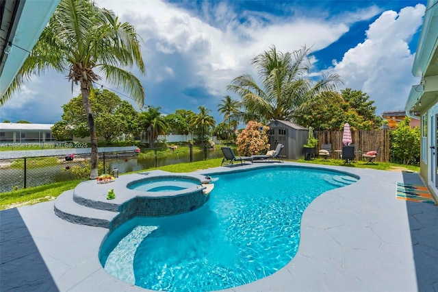 2239 NW 65th Ave, Margate, FL 33063 - view of swimming pool with a shed, a pool with connected hot tub, a fenced backyard, and a patio area