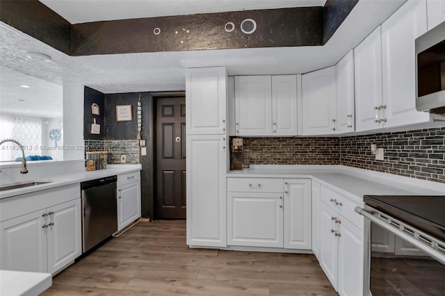 2239 NW 65th Ave, Margate, FL 33063 - kitchen with stainless steel appliances, light countertops, backsplash, and recessed lighting