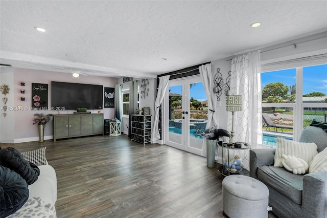 2239 NW 65th Ave, Margate, FL 33063 - living area with french doors, a textured ceiling, recessed lighting, and wood finished floors