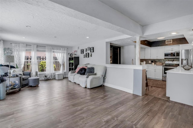 2239 NW 65th Ave, Margate, FL 33063 - living area featuring wood finished floors, recessed lighting, and a textured ceiling
