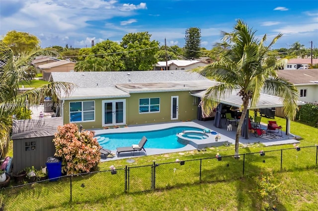 2239 NW 65th Ave, Margate, FL 33063 - view of swimming pool with french doors, a fenced backyard, a patio area, a pool with connected hot tub, and a gate